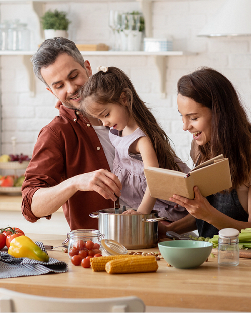 Flexitarian lifestyle photo showing family preparing plant-based meal 