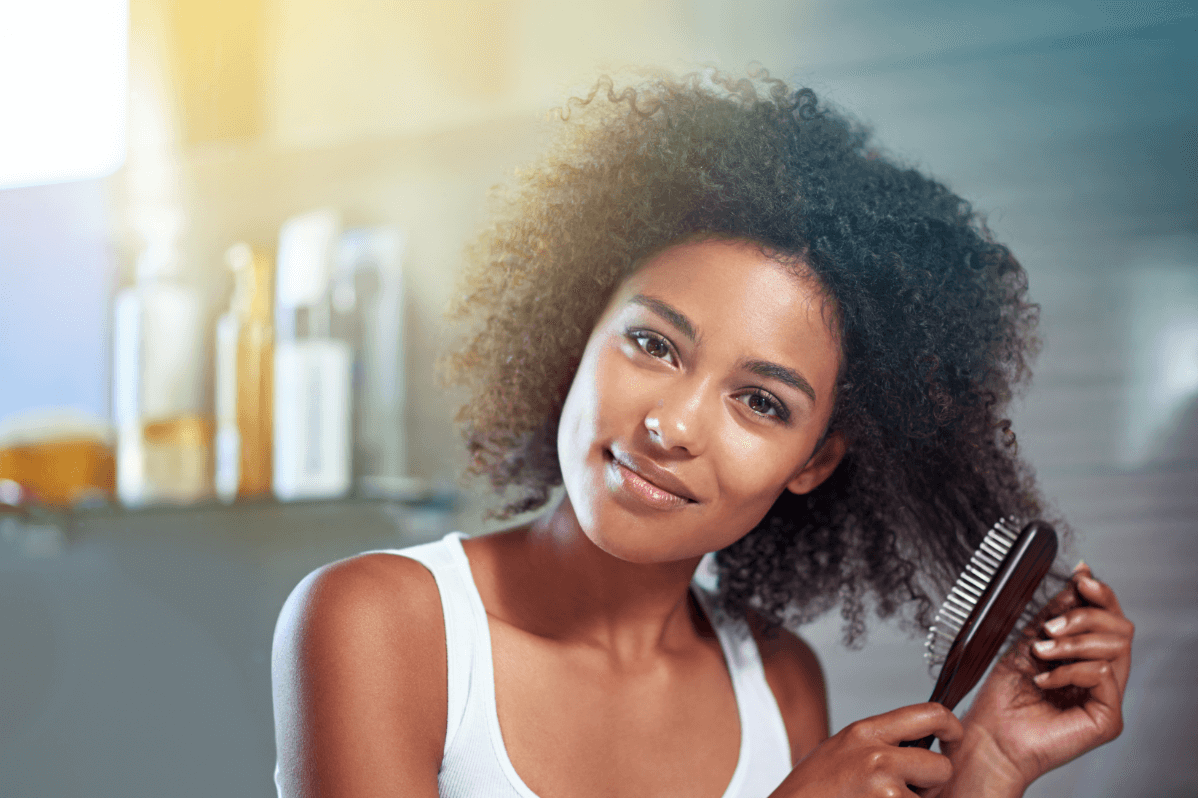 girl brushing hair 